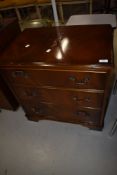 A late 20th century reproduction mahogany music cabinet with fall 'drawer' front, w 63cm