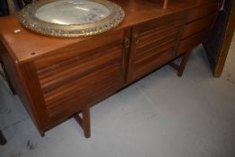 A vintage McIntosh sideboard having louvre doors and three drawers