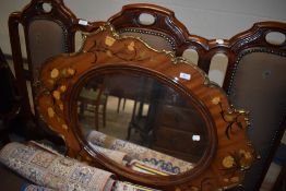 An ormalu framed Rococo style mirror having inlayed frame