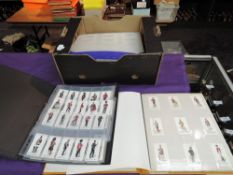 A collection in 5 albums and sheets of reproduction Cigarette Cards