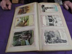 A vintage album containing approx 350 vintage GB & World Post Cards