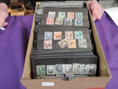 A box containing 300+ small stock cards of World Stamps, mint & used, early stamps, very little if