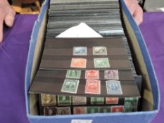A box containing 300+ small stock cards of World Stamps, mint & used, early stamps, very little if