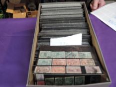 A box containing 350+ small stock cards of World Stamps, mint & used, early stamps, very little if