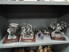 Seven fantasy figures from In Wizard and Myth and Magic including Pool of fire, Celtic Stone and