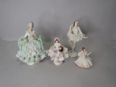 Four female figure studies marked Dresden in traditional dance and ballet costumes