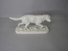 A Royal Nymphenburg study, Irish setter, on ceramic base, 431 17 to underside.