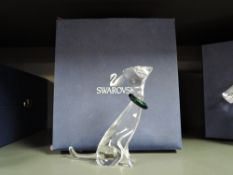 A crystal glass Swarovski figure study of a cat with green collar having box