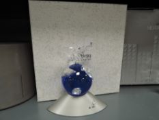 A crystal glass Swarovski figure study of the Millennium Globe with case