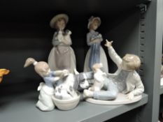 Four figure studies three by Nao and similar Lladro bathing dog