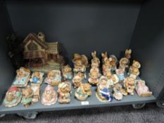 A large collection of Pendelfin bunny rabbit figures including house and beds