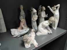 Nine figure studies by Lladro including sleeping angel, girl with chicken, girl with chamber stick