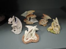 Five fantasy dragon figures by Holland studio craft from the Enchantica range