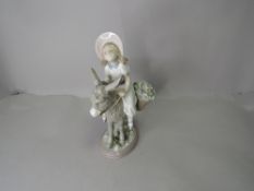 A Lladro Figurine, Look At Me, girl riding donkey carrying two baskets of flowers model no 5465