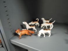Six Beswick studies,five Foxhounds 2262,944,2265,941,943 and a fox 1440.