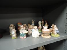 Nineteen Beswick and Royal Doulton figures including Yoch Yoch in the tub, Benjimin Bunny etc