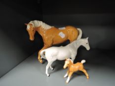 Three Beswick and Royal Doulton studies, Horses and Pony including Spirit of youth,Palomino gloss,