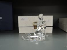 A crystal glass Swarovski figure study of a Mermaid with box