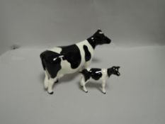 Two Beswick studies Friesian cow 1362A and Friesian Calf 1249C
