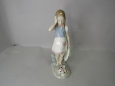 A Lladro Figurine, My Goodness, girl holding hat looking at flowers, slight af to petals, model no