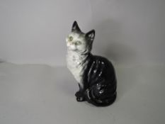 A Beswick study of a seated Persian cat no. 1030