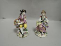 Two figure study groups in a Meissen style with traditional dress