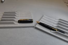 A Burnham 49 leverfill fountain pen in black with single band to cap having Burnham Super Quality