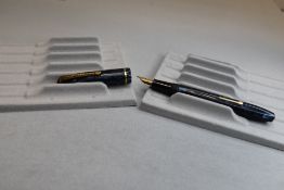 A Conway Stewart 15 leverfill fountain pen in blue/black marble with single band to cap having