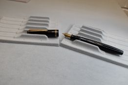 A Parker Victory button fill fountain pen in black with two narrow bands to the cap having a