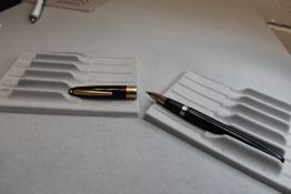 A Sheaffer Valiant Snorkel fill fountain pen in black with a broad band to the cap having a Sheaffer