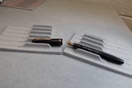 A Parker Victory button fill fountain pen in black with two narrow bands to the cap having a