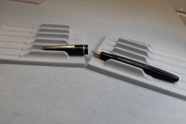 A Conway 150 Vacuum fill fountain pen in black with single band to cap having a Conway Stewart