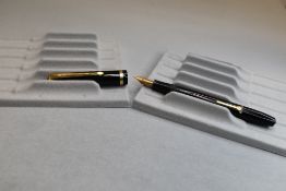 A Conway Stewart 12 leverfill fountain pen in black with single band to the cap having Conway 14ct