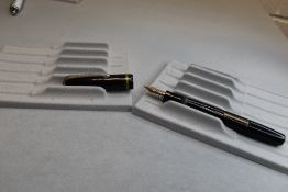 A Burnham 48 leverfill fountain pen in black with single band to cap having Burnham B45 Medium
