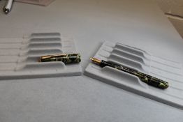 A Parker Vacumatic Junior Slender button fill in green marble with two narrow bands to the cap