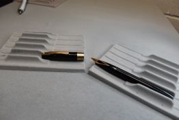 A Sheaffer Imperial IV Touchdown plunger fill fountain pen in black with a single broad band to