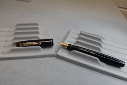 A Parker Victory button fill fountain pen in black with single band to cap having a Parker N nib.