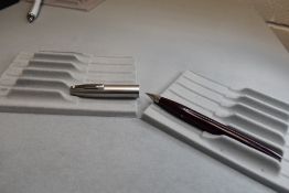 A Sheaffer Imperial II Deluxe Touchdown plunger fill fountain pen in burgundy with a brushed steel