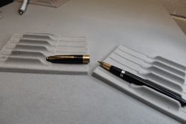 A Sheaffer Valiant Snorkel fill fountain pen in black with a broad band to the cap having a Sheaffer