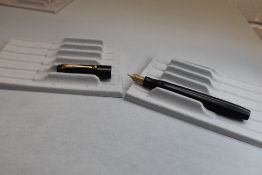 A Parker Victory button fill fountain pen in black no bands to cap having Parker N nib. Approx 12.