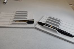A Parker 45 vacuum fill fountain pen in black. Approx 13.6cm