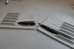 A Sheaffer Cadet plunger fill fountain pen in green with a broad band to the cap having a Sheaffer