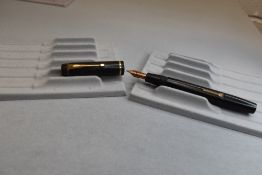 A Conway Stewart 45 leverfill fountain pen in black with single band to cap having Conway Stewart