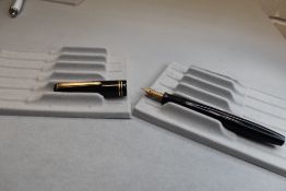 A Parker Victory button fill fountain pen in black with two bands to the cap having Parker 25 9 nib.