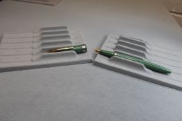 A Conway Stewart 68 vacuum fill fountain pen in duck egg green with single medium band to cap having