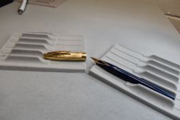 A Sheaffer Imperial IV Touchdown plunger fill fountain pen in black with a gold cap having a