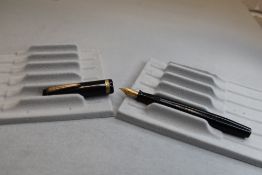 A Parker Televisor Junior button fill fountain pen in black with single band to cap having a