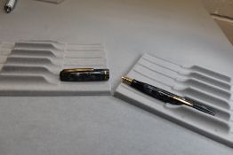 A Burnham 44 leverfill fountain pen in blue and grey with gold veining with single narrow band to