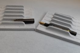 A Conway Stewart Dinkie 540 leverfill fountain pen in black (discoloured) with ring cap having a