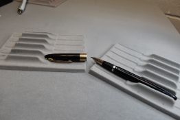 A Sheaffer Valiant Snorkel fill fountain pen in black with a broad band to the cap having a Sheaffer